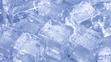 Cubes of ice covered with water drops. Frozen water in form of a cube, ice. Critically pure ice.