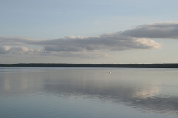 Obraz premium Sights of Belarus. Lake Naroch. Reflection of the evening sky in the lake.