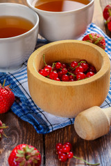 Currants and strawberries on the table. Breakfast.