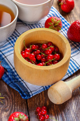 Currants and strawberries on the table. Breakfast.