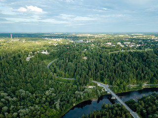 Fototapeta na wymiar drone image. aerial view of forests and river Gauja in the middle in summer day. Latvia, Sigulda municipality