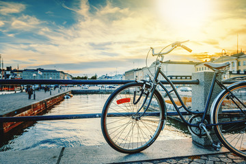Black retro bicycle parked on the waterfront of Helsinki, the capital of Finland, against the...