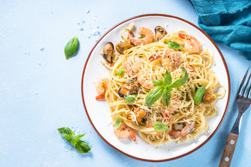 Pasta spaghetti with seafood and cream sauce.