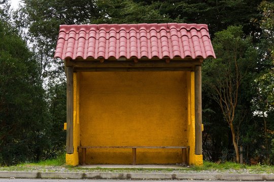 Traditional yellow bus stop in Puerto Varas, South Chile. Transportation concept