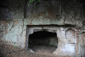 Obraz premium The amazing necropolis of Sutri near Rome is one of the best preserved Etruscan-Roman necropolis of the whole Tuscia, with different types of Etruscan tombs