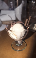 white and chocolate icecream in a glass goblet