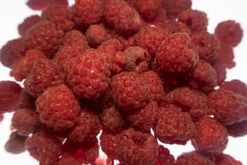 bright colorful raspberry on a white background