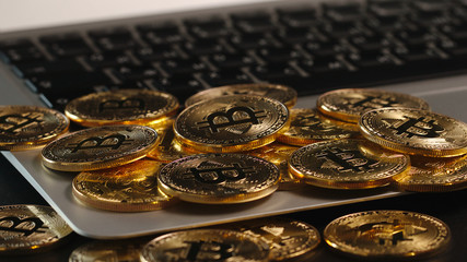 Bitcoin mining - coins appears on a laptop