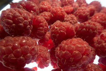 bright colorful raspberry on a white background