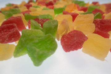 bright colorful candied fruits on a white background