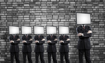Businessmen with TV instead of head.