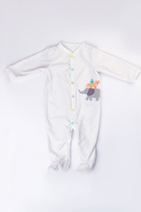Footed baby pajamas isolated on white. © margostock