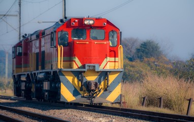 Obraz premium Red Diesel Electric Locomotive on a sunny day