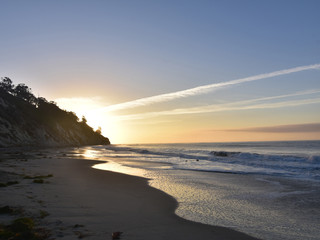 Sandy beach off the coast during a beautiful sunrise