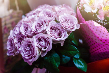 Purple roses in a wedding arrangement