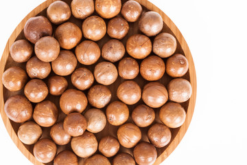 Macadamia nuts or Australian walnuts on white background