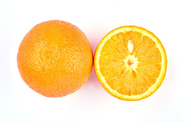 Fresh whole and sliced orange fruit. Juicy orange fruit on light background close up. Delicious tropical fruit.