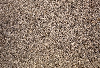 The texture of a stone fence made of granite. Background