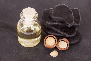 Macadamia nuts oil or Australian walnuts on white background