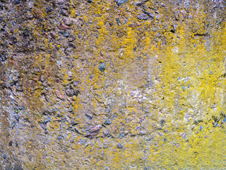 The texture of a stone fence made of granite. Background