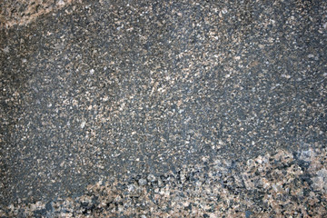 Multicolored natural stone texture, smooth granite surface, may be used as background 