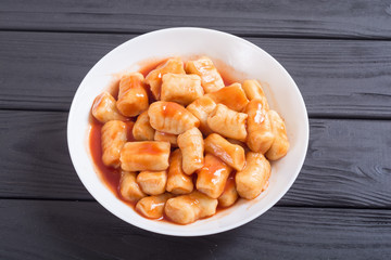 Homemade potatoes gnocchi with tomato sauce .