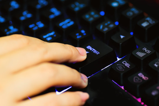 Playing computer game with gaming gear.