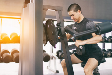 Asian man exercising in the gym,