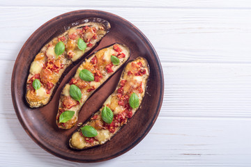 Eggplant with tomatoes , cheese and basil