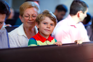 Grandmother taking child, kid boy to school on his first day