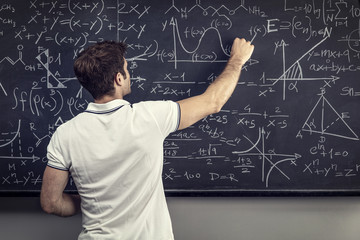 teacher write on blackboard