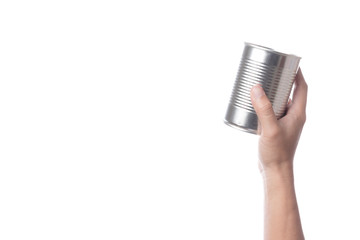 Fototapeta na wymiar Hand holding tin or steel can made of aluminium for food