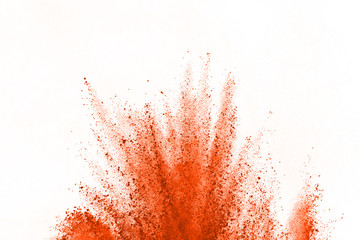 OrangeRed powder explosion isolated on white background. Explosion of colored clouds or  dust...