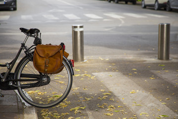 image of half black bicycle with backpack on the rear wheel.JPG