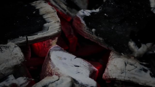 Smoldering coals of bonfire on outdoor