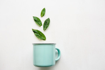 A concept or creative idea that signifies a useful drink or herbal or green tea. From the mug fly leaves