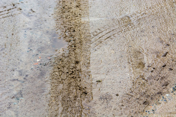 Traces from wheels of the car on a sand road