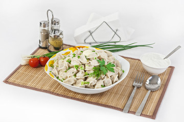 Russian dumplings with herbs and onions.