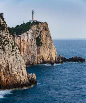 Sunset view with magical lighthouse over Cape of Doukato,  Lefkada island in Ionian Sea, Lefkas, Greece
