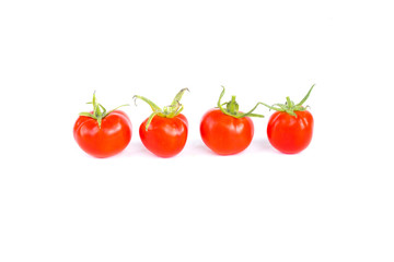 Four fresh juicy red cherry tomatoes in line, organic food ingredient, close up, isolated on white background