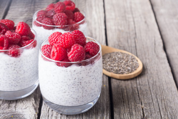 Chia pudding in glass with raspberry