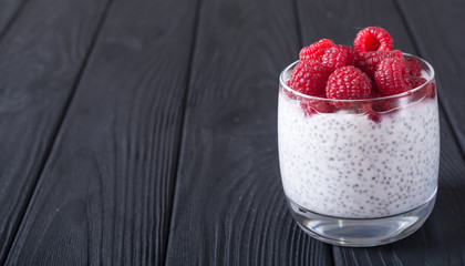 Chia pudding in glass with raspberry