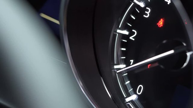 Close up of car dashboard with visible speedometer
