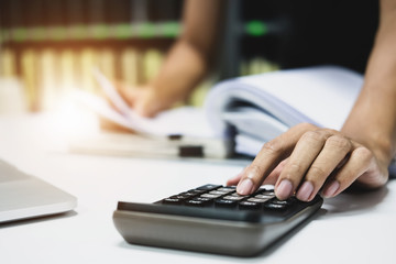 Bookkeeper Budget Check, Employees Use Calculators to Calculate Annual Taxes 2018.