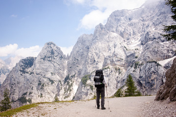 Man looking up the Triglav mountain in Triglav national park, Slovenia