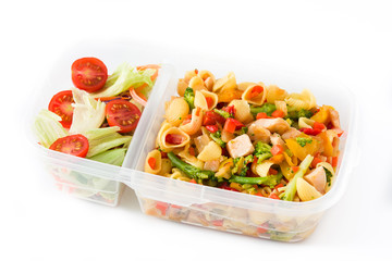 Healthy meal prep container with pasta salad with turkey and vegetables isolated on white background