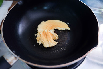 Making pancakes on frying pan , top view.
