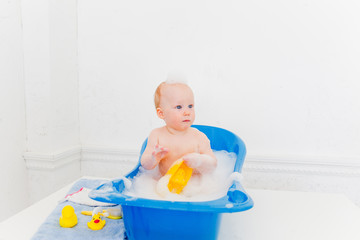 Baby boy in a bathroom