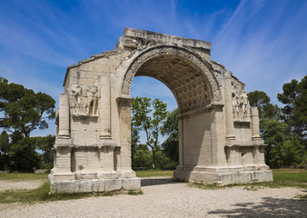 Fototapeta na wymiar Roman Arch of Triumph in ancient Glanum. Saint Remy-de-Provence, Bouches-du-Rhone, Provence-Alpes-Cote d‘Azur, Southern France, France, Europe