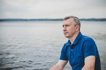 Mature European man with a sad philosophical mood. The concept of life after 50 years, problems and...